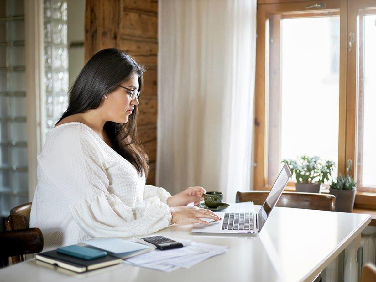 Woman balancing her checkbook